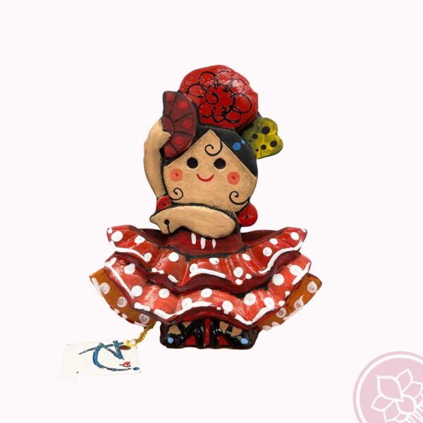 Figura de una  flamenca con peina, flor y abanico bailando. Esta pieza de cerámica es obra original del artista gaditano Antonio Ruano. medida: 13,50 cm. de alto