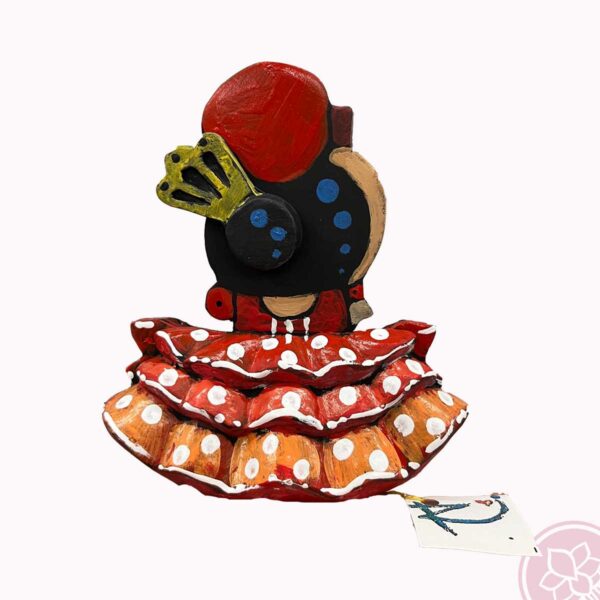 Figura de una  flamenca con peina, flor y abanico bailando. Esta pieza de cerámica es obra original del artista gaditano Antonio Ruano. medida: 13,50 cm. de alto